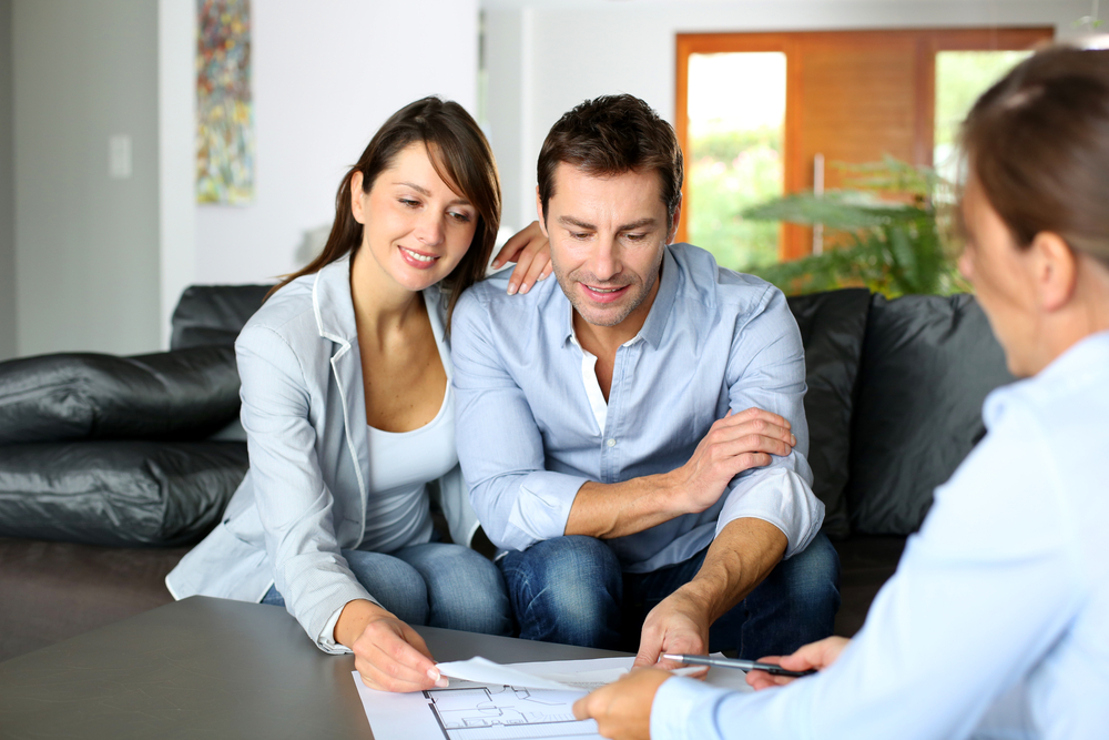 Couple meeting consultant for financial contract Couple meeting consultant for financial contract